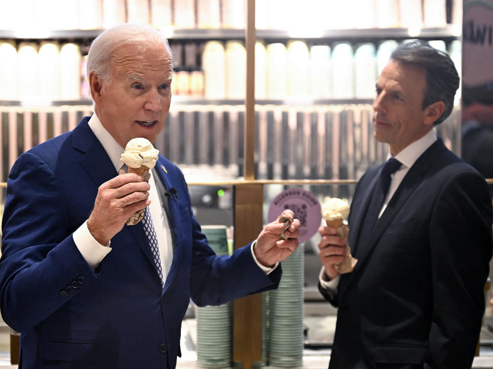 President Biden talks to reporters about Gaza while eating ice cream with late night host Seth Meyers in New York City on Feb. 26, 2024.