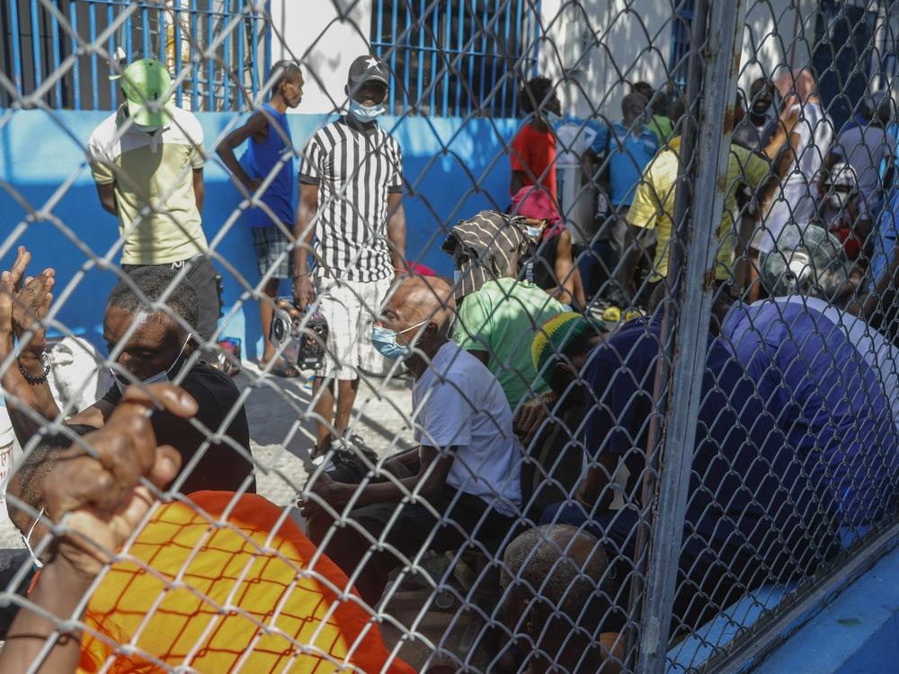 Inmates gather inside the National Penitentiary in downtown Port-au-Prince, Haiti, Sunday, March 3, 2024.