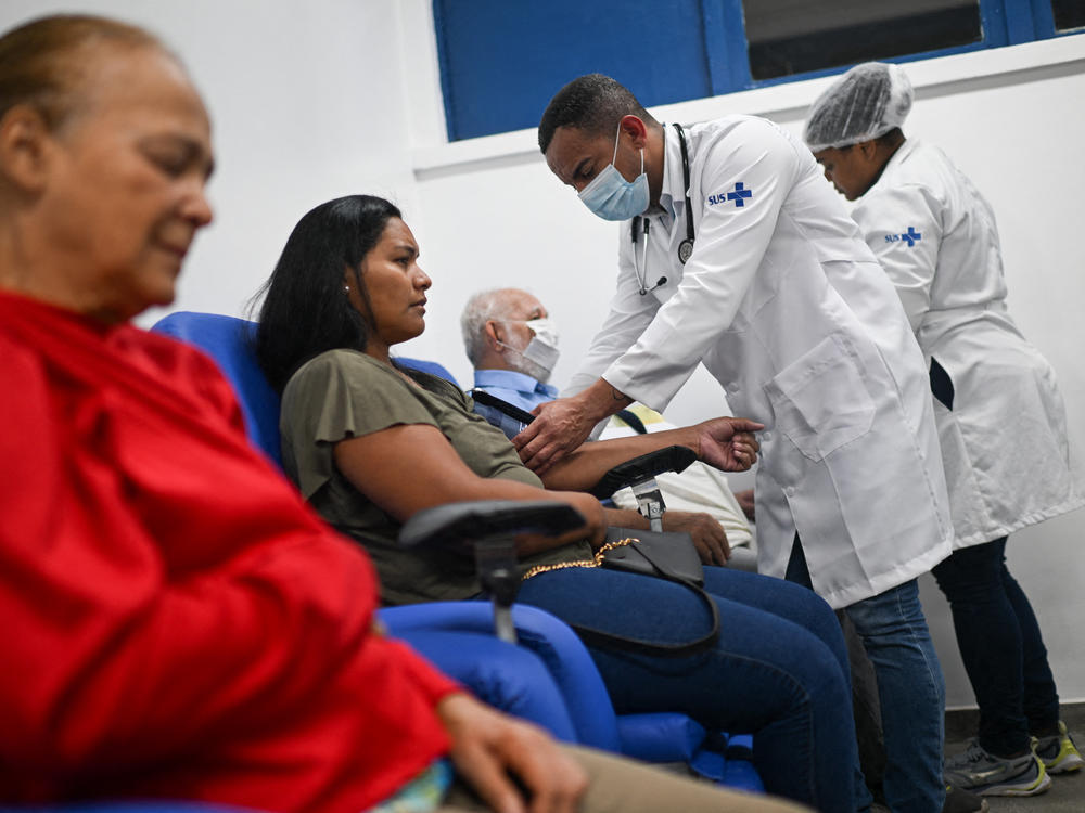 Patients with dengue symptoms are seen at the Municipal Hospital Raphael de Paula Souza in Rio de Janeiro, Brazil, on Feb. 5. The virus can can start with fever, rash, muscle and joint pain and progress to persistent vomiting, bleeding from the gums and nose and difficulty breathing.