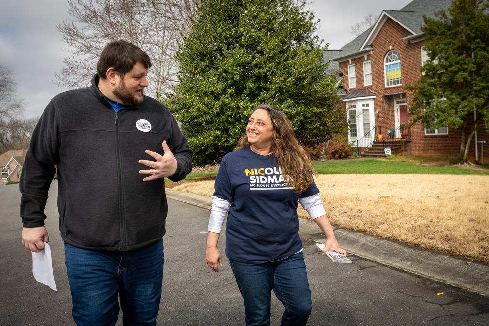 Nicole Sidman and Sam Spencer, her campaign manager, canvass door-to-door in the suburbs of Charlotte, N.C., ahead of Super Tuesday. Sidman is running for North Carolina House District 105.