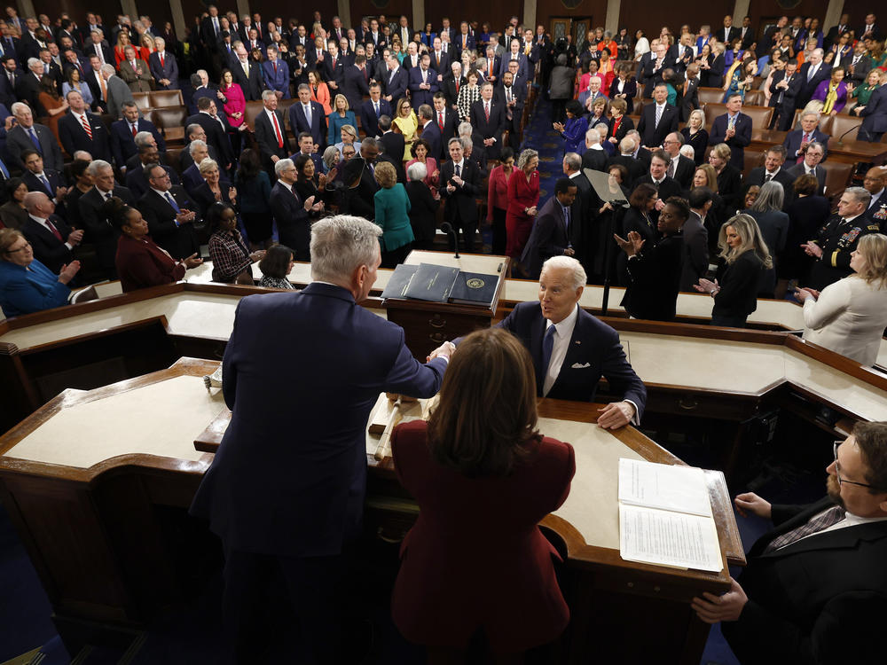 President Biden arrives and greets House Speaker Kevin McCarthy as Vice President Kamala Harris looks on, ahead of the State of the Union speech last year.