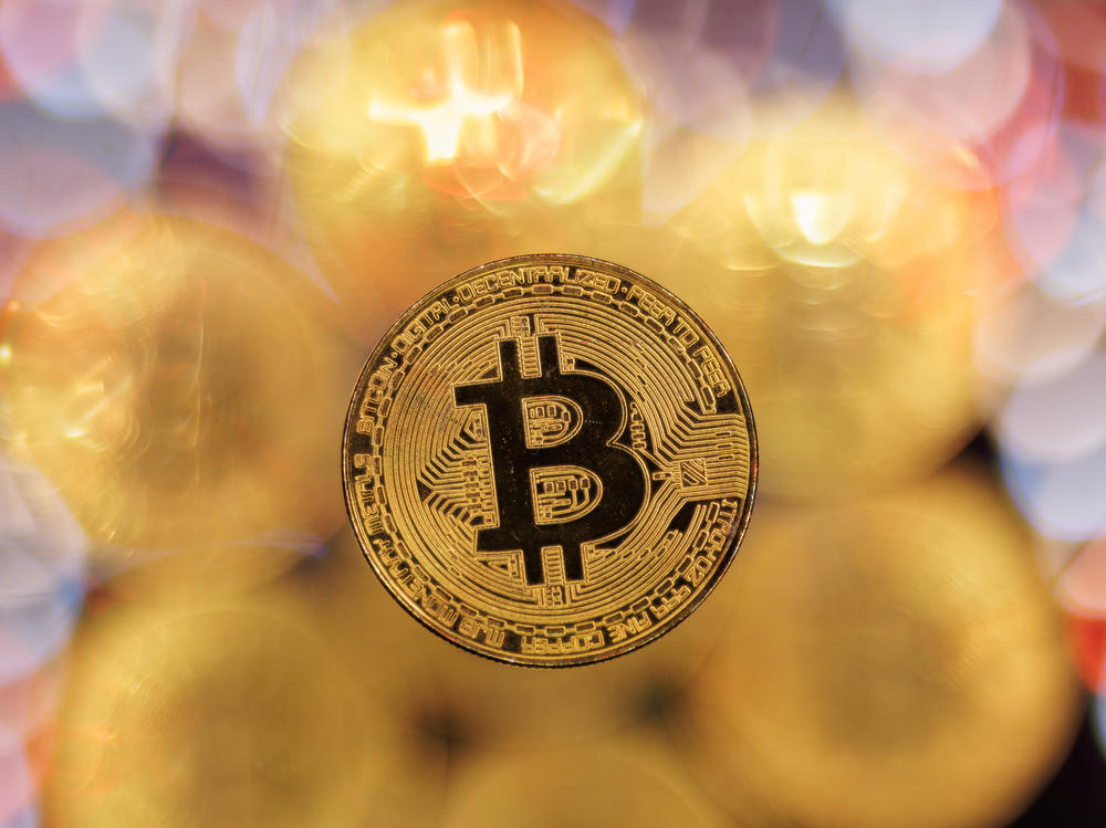 Bitcoin hit a record high following a rally sparked by the Securities and Exchange Commission's approval of bitcoin exchange-traded funds.