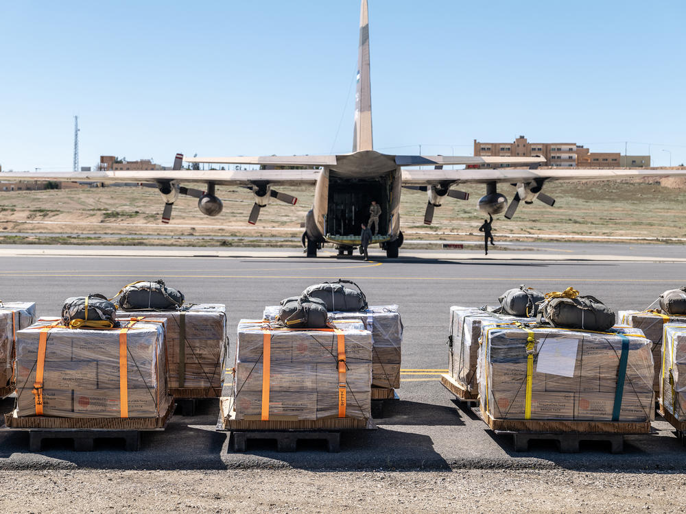 Pallets of aid await to be loaded into a Jordanian Air Force C-130 aircraft Thursday, Feb. 29, in Zarqa, Jordan, before an airdrop mission over Gaza.