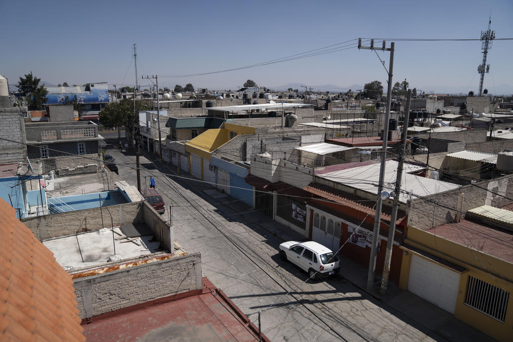 The sun shines over roofs of the Ciudad Azteca neighborhood of Ecatepec on Sunday.