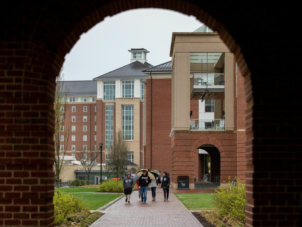 Students walk across Liberty University's campus in Lynchburg, Va.
