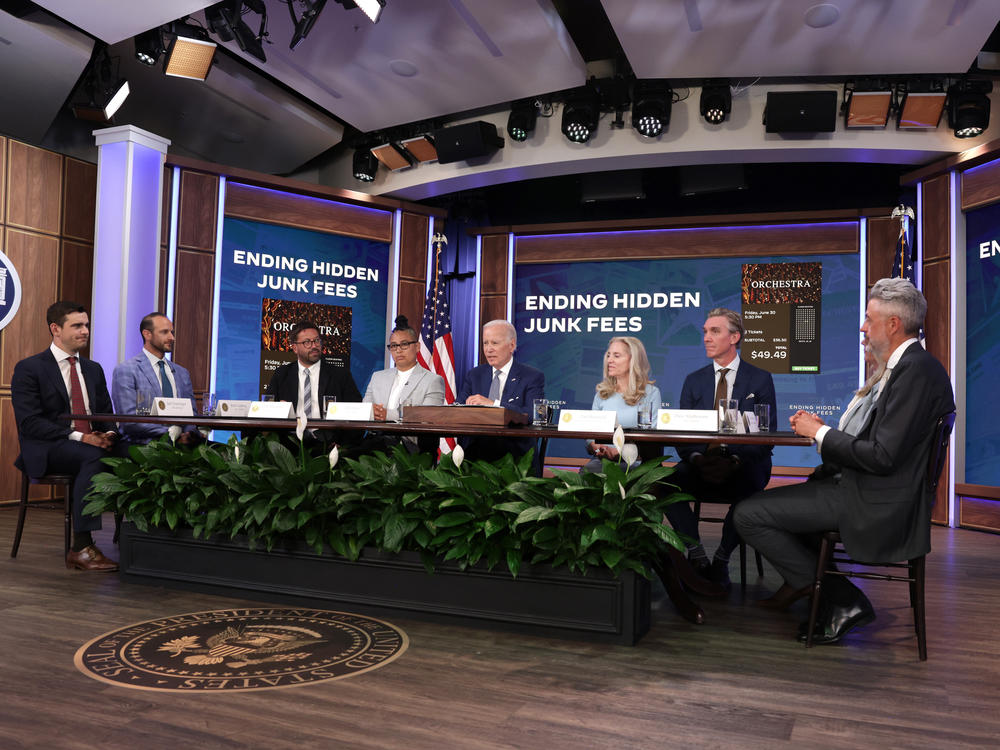 President Biden delivers remarks on protecting consumers from hidden junk fees while seated among CEOs of ticketing companies such as SeatGeek, TickPick, Dice and Live Nation.