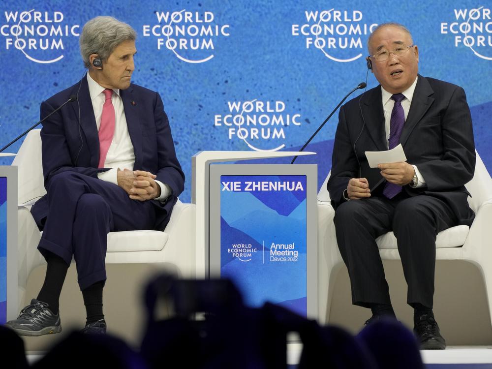 John Kerry, left, listens to Xie Zhenhua, Special Envoy for Climate Change for China, during the World Economic Forum in Davos, Switzerland, in 2022.