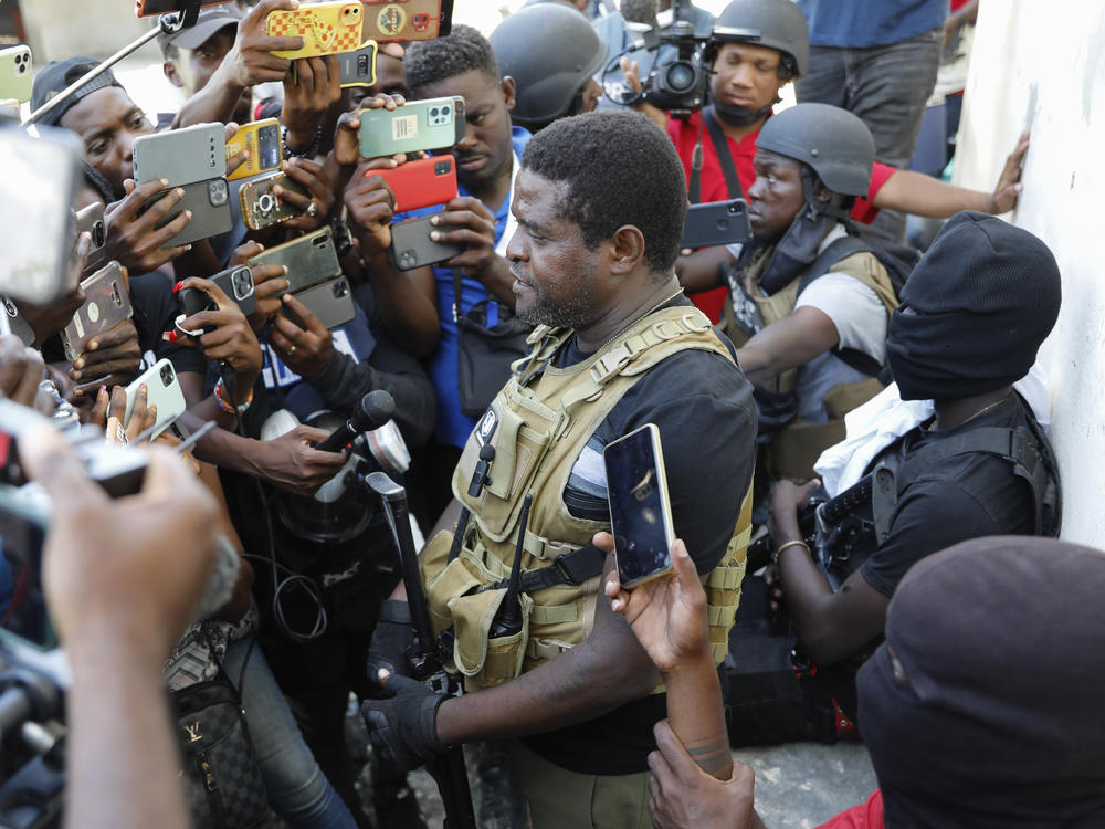 Barbecue, the leader of the G9 and Family gang, speaks to journalists in the Delmas 6 neighborhood of Port-au-Prince on Tuesday.