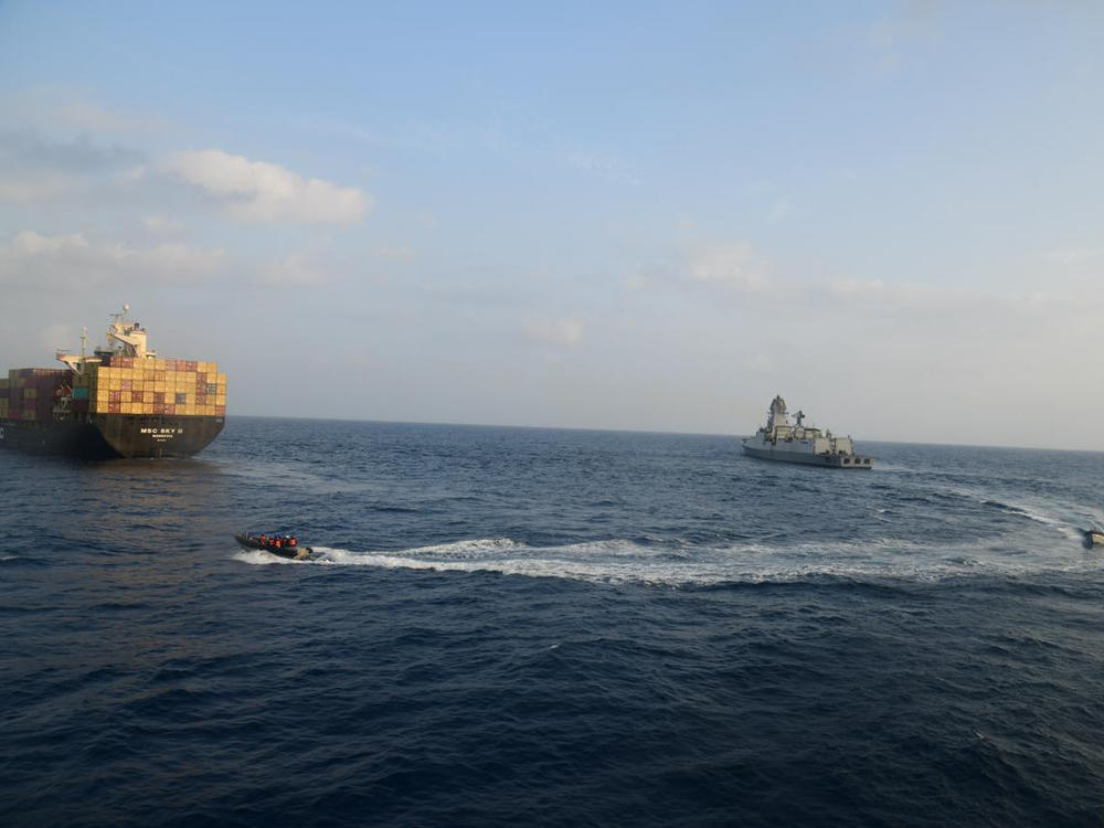 This photograph shared by the Indian Navy on the X platform shows a firefighting team from Indian Navy vessel INS Kolkata responding to a fire on Liberian-flagged Merchant ship MSC Sky II caused due to a suspected drone/missile attack in the Gulf of Aden on Tuesday.