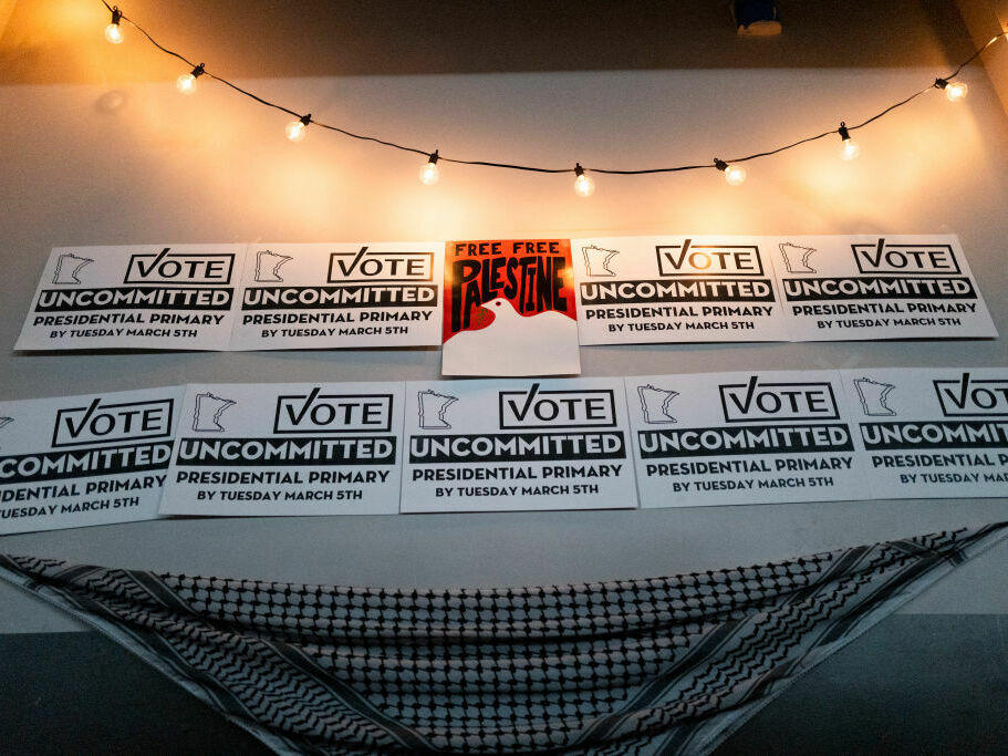Placards adorn a wall at an Uncommitted Minnesota watch party during the presidential primary in Minneapolis on Super Tuesday.