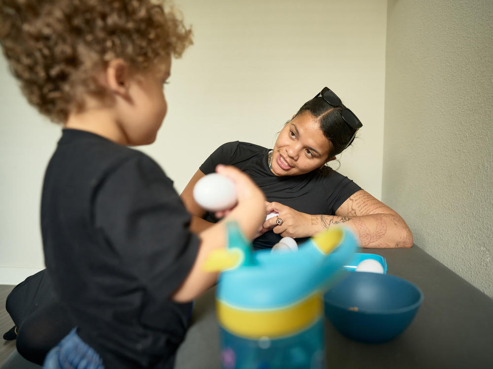 Barnes and her son eat breakfast before starting their day. Barnes is studying Business Administration at San Antonio College, and Samuel spends his days in a Head Start classroom on campus.