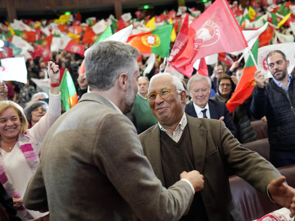 Socialist Party leader Pedro Nuno Santos, left, greets Portuguese Prime Minister Antonio Costa as he arrives for an election campaign rally in Lisbon, March 5, 2024.