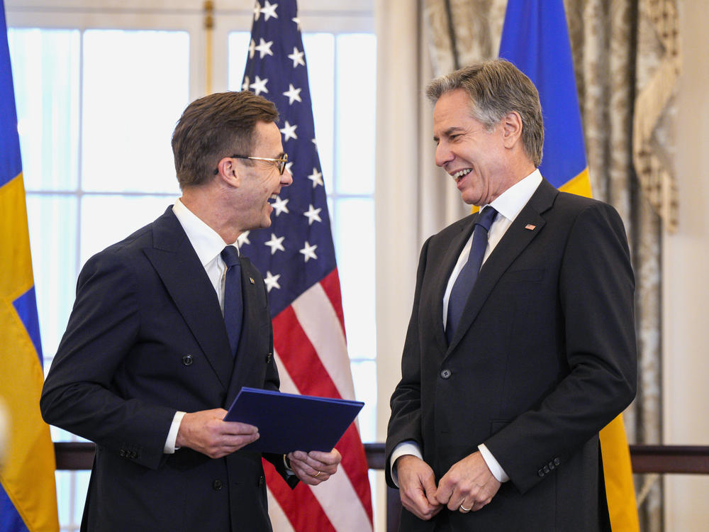 U.S. Secretary of State Antony Blinken (right) stands with Swedish Prime Minister Ulf Kristersson before presenting Sweden's NATO Instruments of Accession in the Benjamin Franklin Room at the State Department on Thursday in Washington