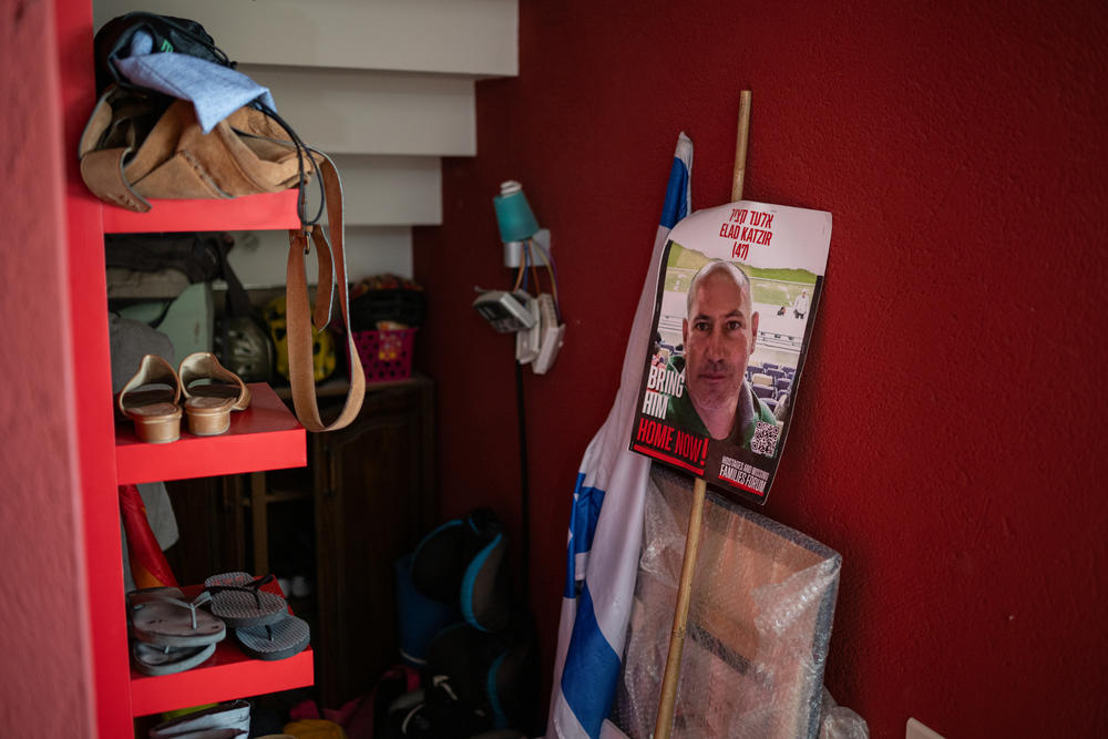 A poster with a photo of Carmit Palty Katzir's brother Elad, which she brings to rallies, is stored at her home in Haifa.