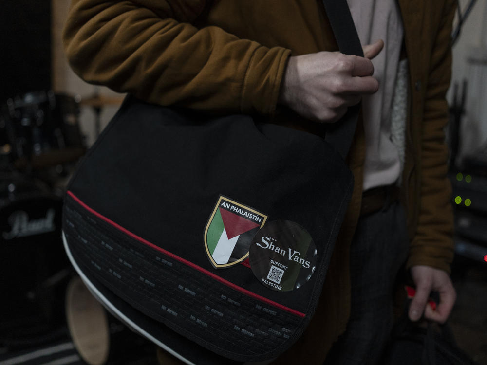 A pro-Palestinian badge can be seen on the bag of Breandan McGlone, lead guitarist for The Shan Vans, an Irish-language rock band, during a practice session at the Blackstaff Mill music studios in West Belfast, Northern Ireland, on Feb. 9.