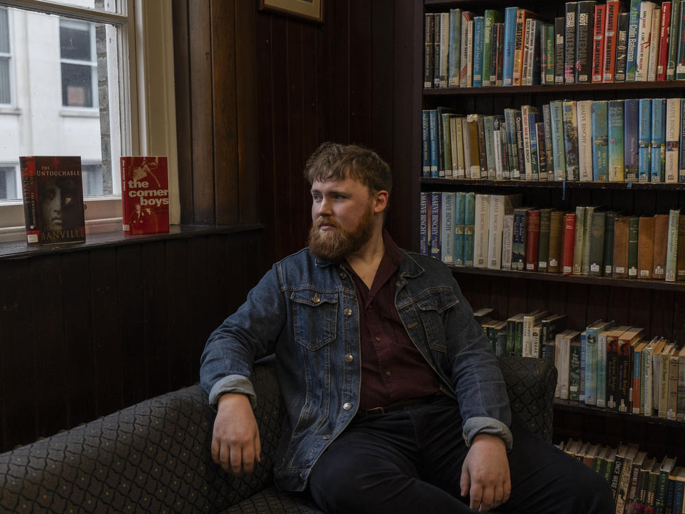 Andy Clarke, a local historian and blogger behind the Tanistry Instagram account, poses for a portrait at The Linen Hall library in central Belfast, Northern Ireland, on Feb. 9.