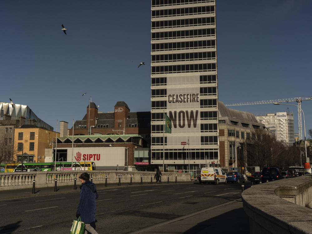 A large sign calling for a cease-fire in Gaza hangs from a building in Dublin on Feb. 12.