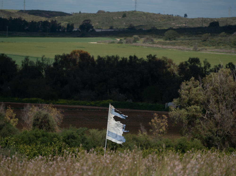A tattered Israeli flag waves on Israel's southern border with the Gaza Strip on Thursday.