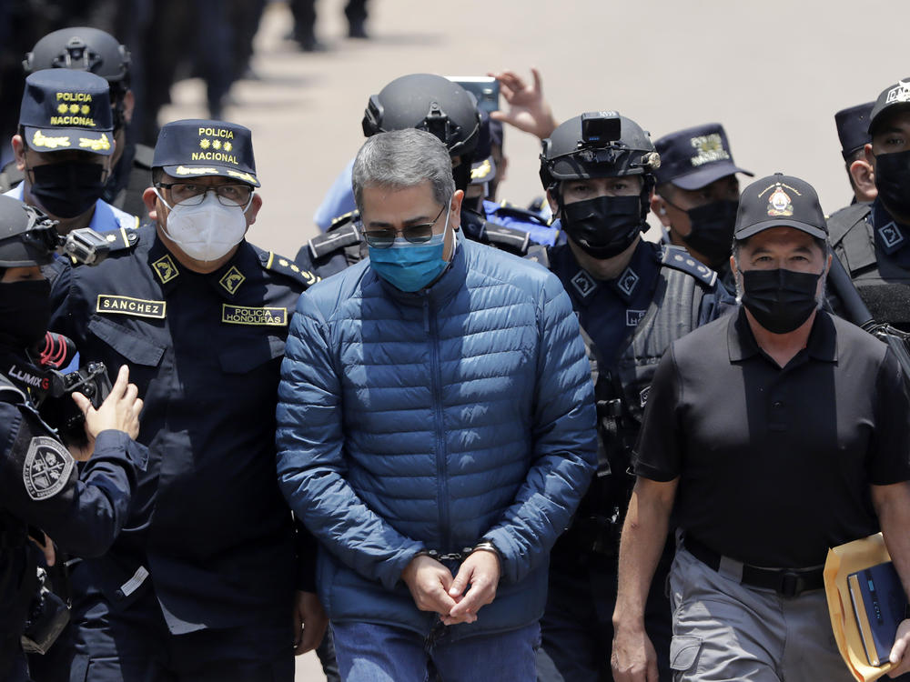 Former President of Honduras Juan Orlando Hernández is escorted by Honduran police to be extradited to the United States to face charges related to drug traffickers, on April 21, 2022, in Tegucigalpa, Honduras.