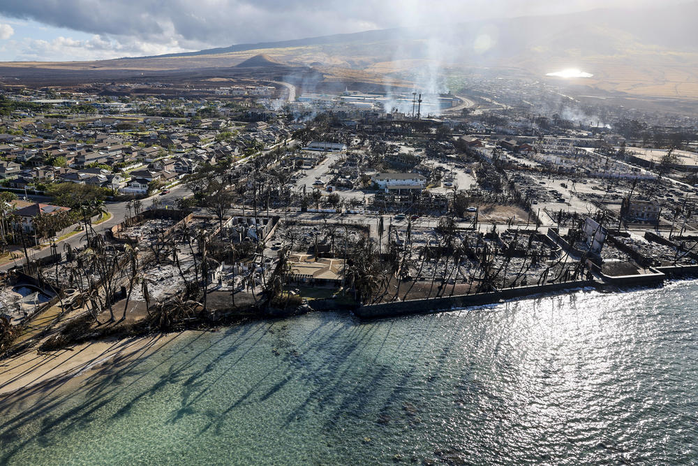 Buildings still smolder days after a wildfire gutted downtown Lahaina.