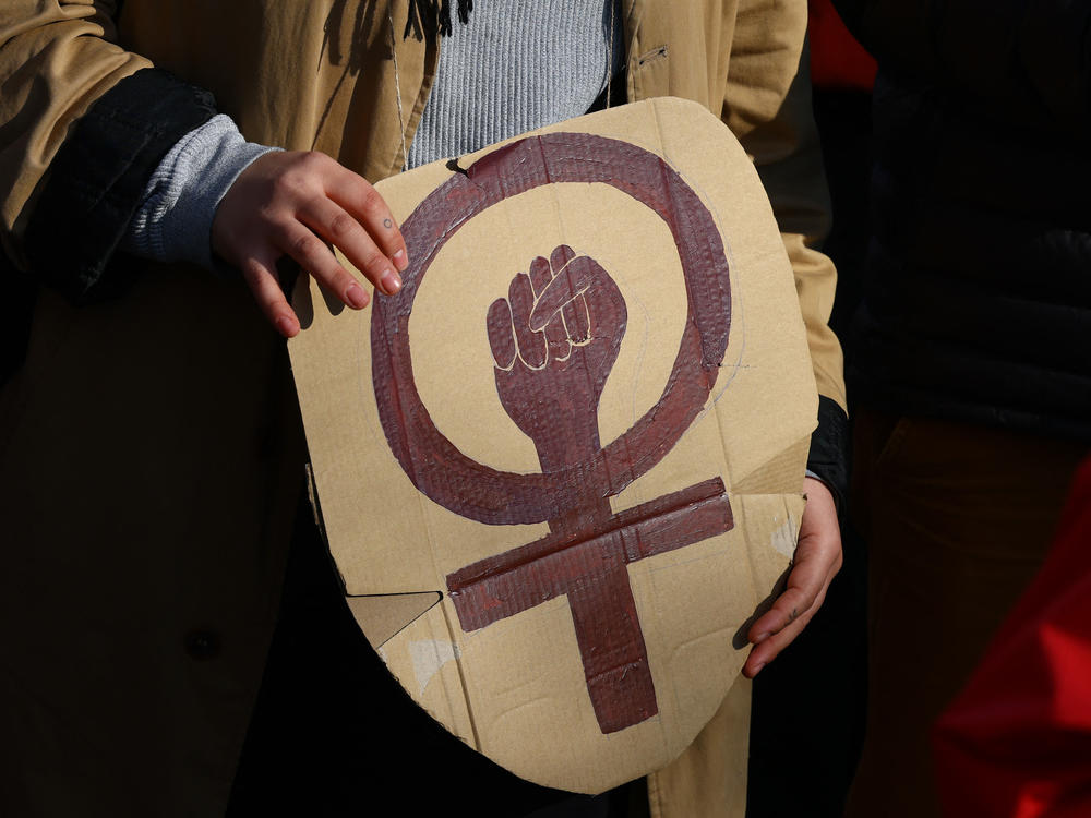 People demonstrate for better living and working conditions for women on International Women's Day in Berlin.