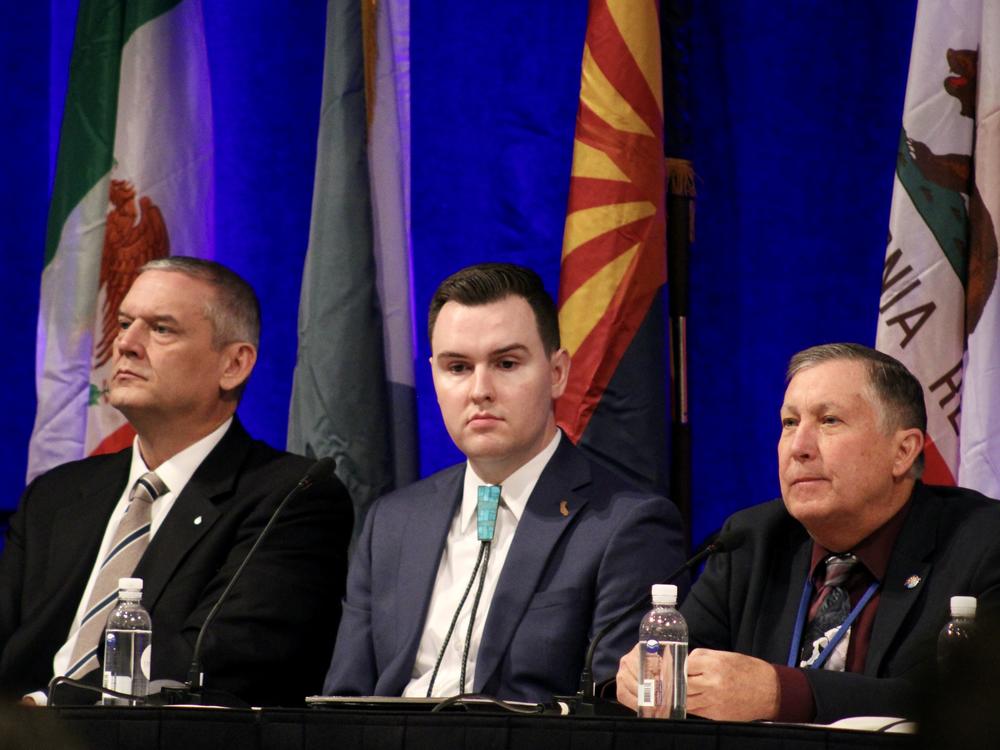 John Entsminger (left), JB Hamby, and Tom Buschatzke sit on a panel at the Colorado River Water Users Association annual meeting in Las Vegas on Dec. 14, 2023. The three men are top negotiators for the Colorado River's Lower Basin states of Nevada, California and Arizona.