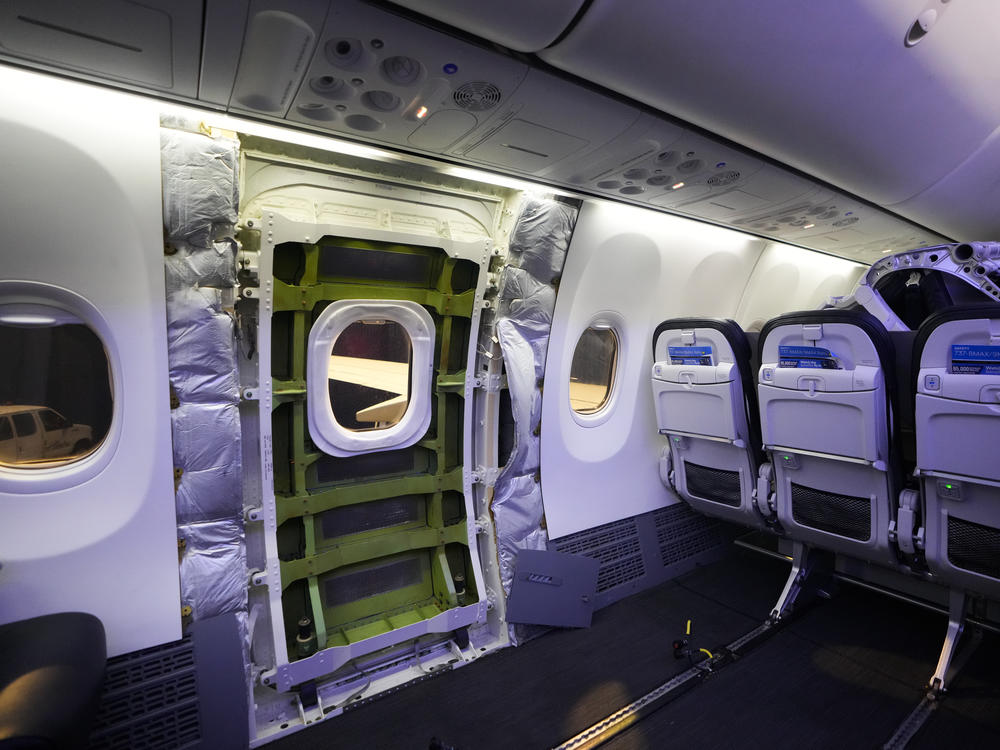 A door plug area of an Alaska Airlines Boeing 737 Max 9 aircraft awaiting inspection is pictured with paneling removed at the airline's facilities at Seattle-Tacoma International Airport on Jan. 10 in SeaTac, Wash.