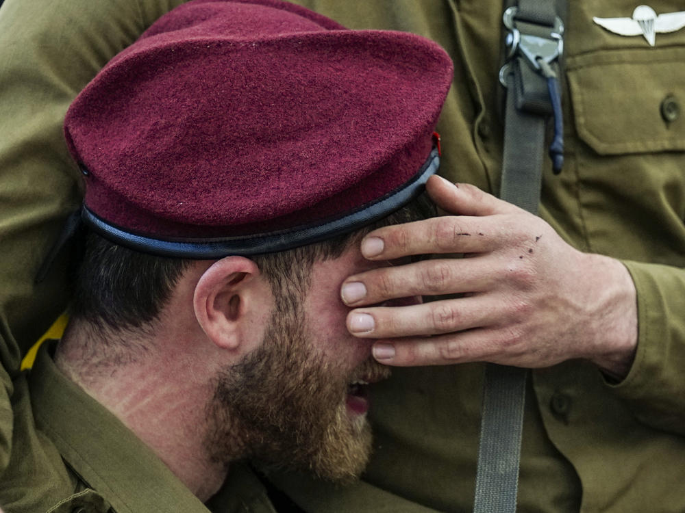 Israeli soldiers mourn during a funeral for Israeli Staff Sgt. David Sasson in Netanya, Israel, on Thursday, March 7.