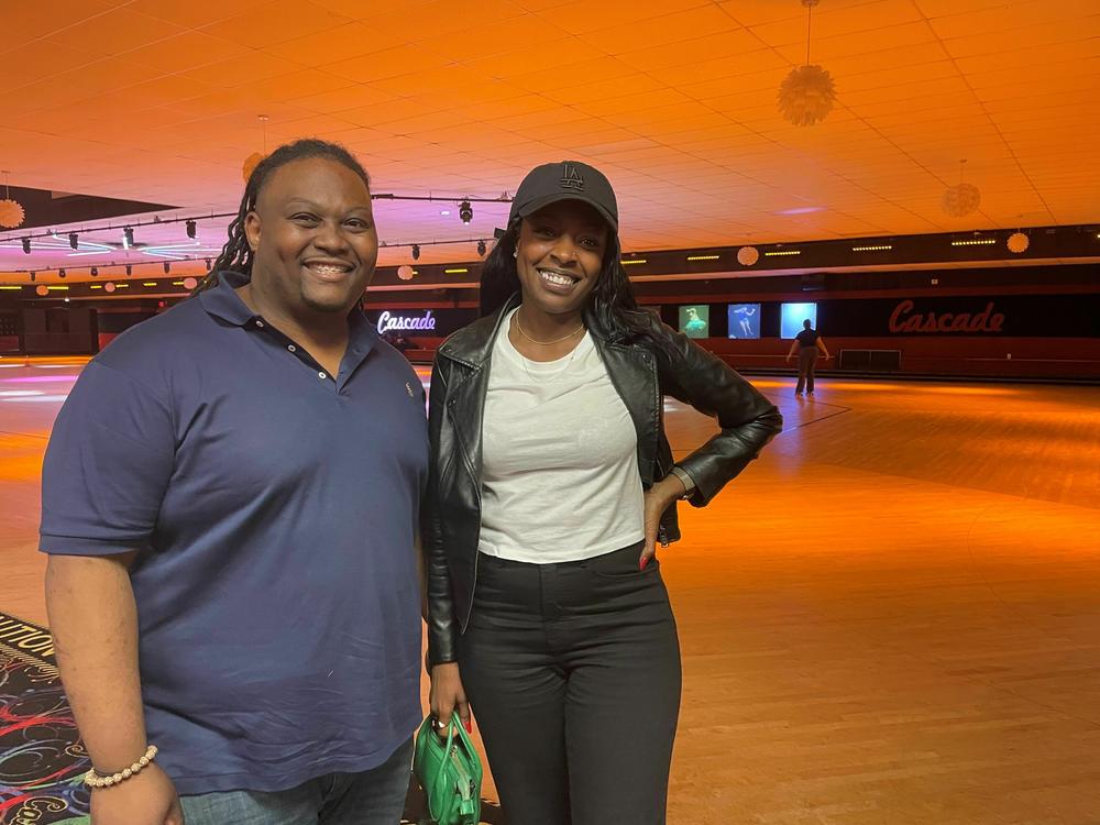Dean Anthony, left, and Nina Smith at Cascade roller skating rink in Atlanta. Anthony and Smith are Democratic strategists encouraging candidates to embrace Black voters where they are - like at this rink, a cornerstone of the community.