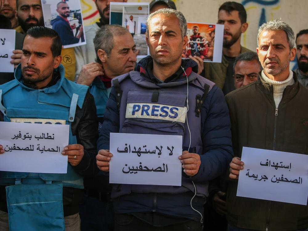 Palestinian journalists stage a protest to draw attention to Palestinian members of the media killed while covering the war in the Gaza Strip on Jan. 15, in Rafah, Gaza.