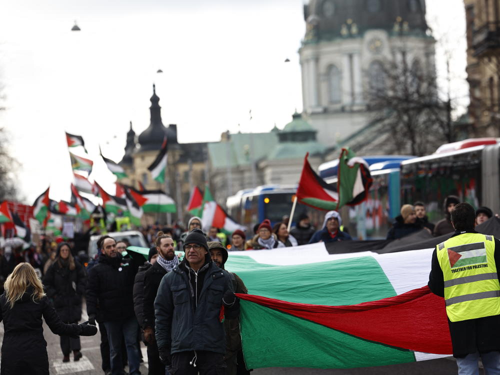 Pro-Palestinian supporters wave flags and carry placards during a march in central Stockholm last month in which demonstrators demanded Israel be excluded from the Eurovision Song Contest.