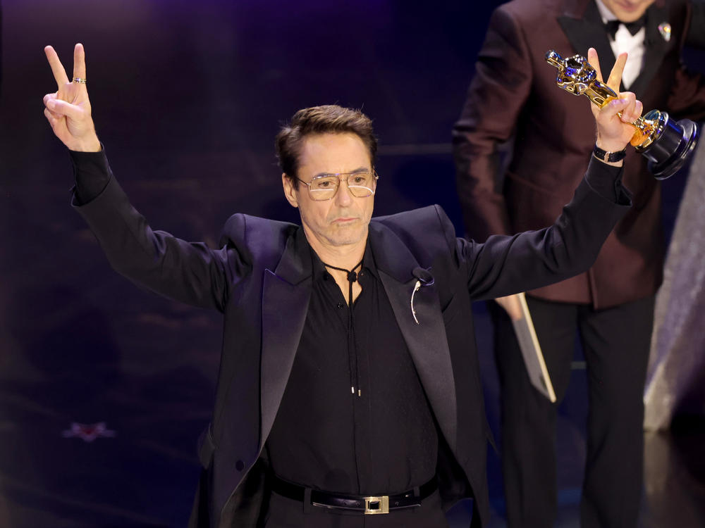Robert Downey Jr. accepts the Oscar for best actor in a supporting role for <em>Oppenheimer.</em>