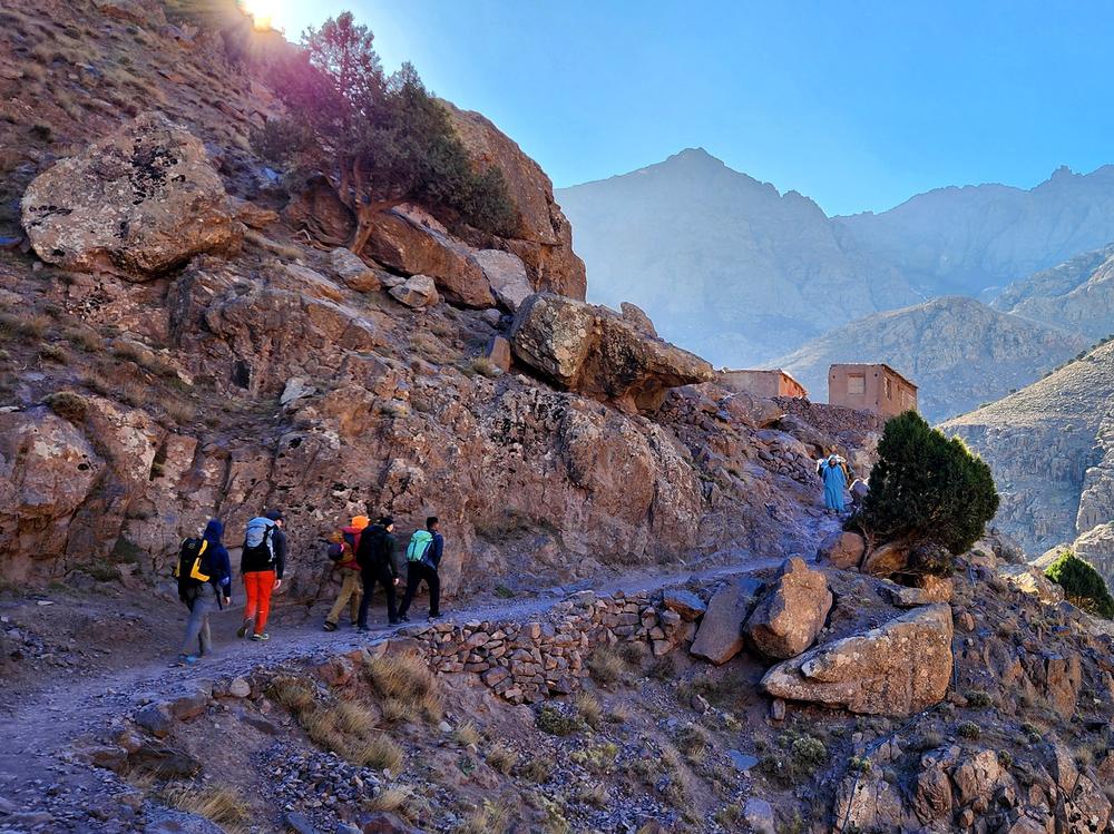 A stony path leads through the Toubkal Valley, climbing toward the highest summits in North Africa.