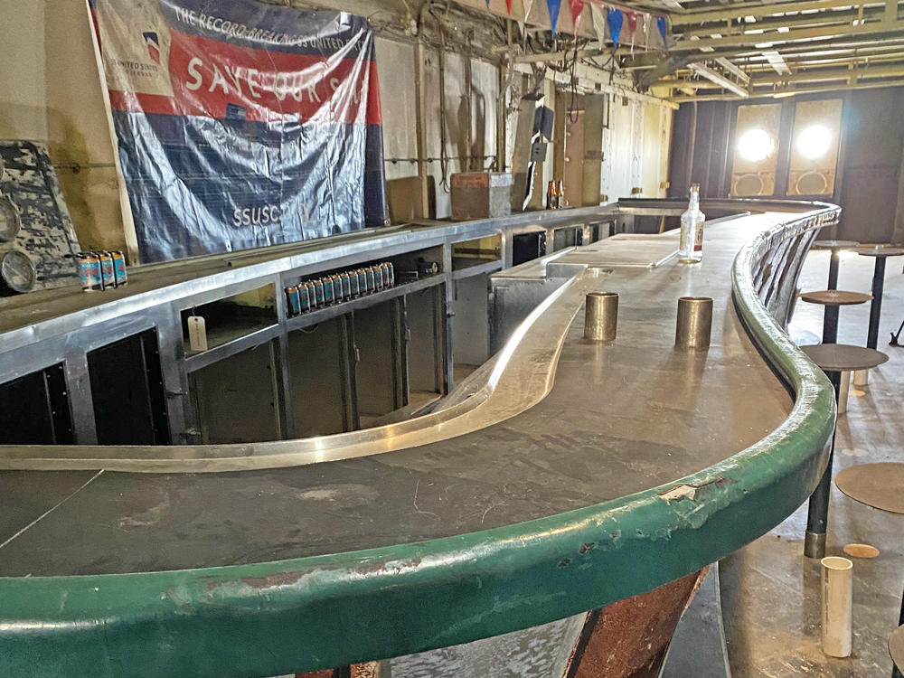 While the interior of the ship was essentially gutted during asbestos removal in the 1990s, the curvy original bar that served up countless martinis and old fashioneds remains intact.