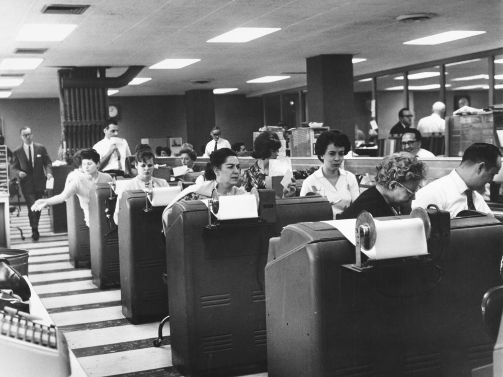 Employees of Goodbody & Co. work at the stock brokerage's headquarters in Manhattan, N.Y., circa 1965.