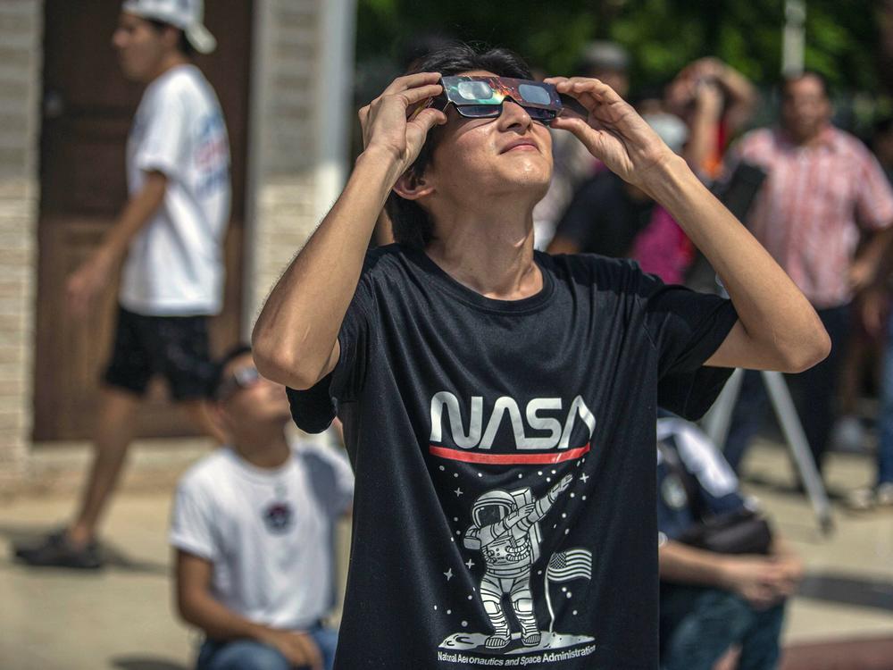 A man watches the annular solar eclipse in Merida, Mexico, last  October.