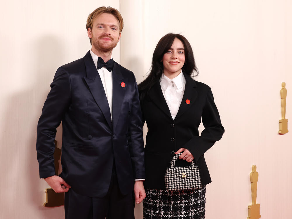 Billie Eilish and Finneas O'Connell wear pins in support of a cease-fire in Gaza while they attend the 96th Annual Academy Awards on Sunday Hollywood, Calif.