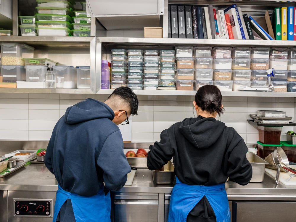 Staff prepare apples in Evett's kitchen.