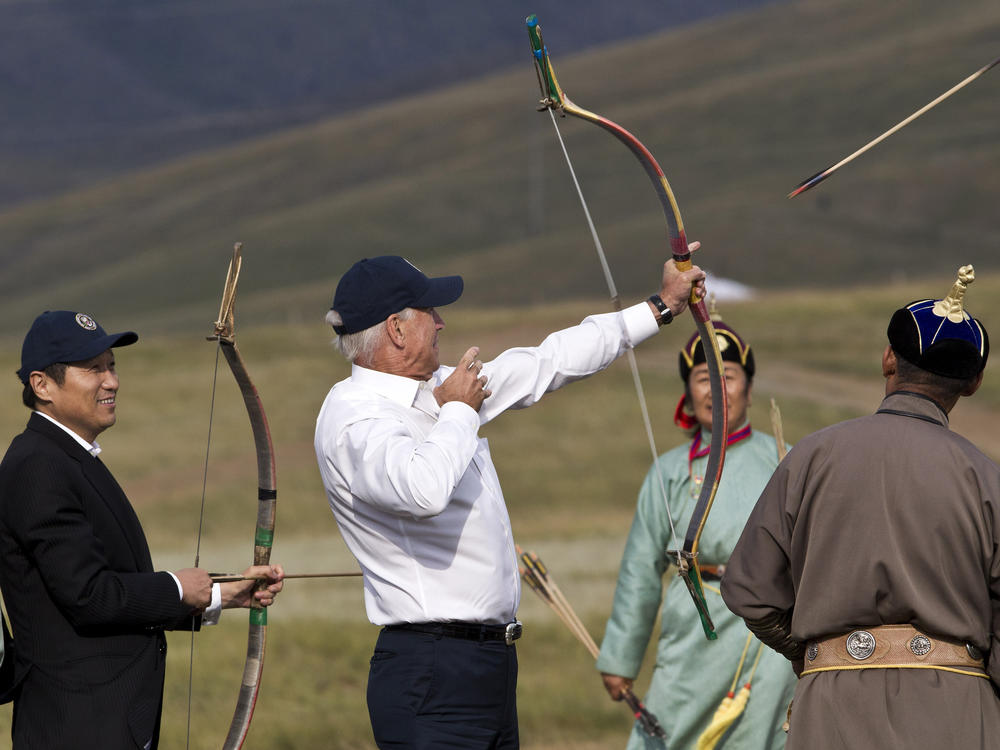Then-Vice President Biden tries out archery on a tour in Mongolia on Aug. 22, 2011.