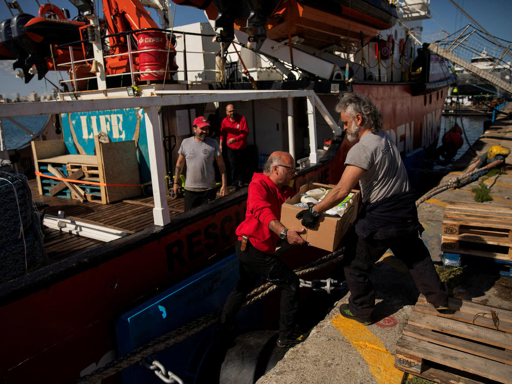 Open Arms members carry humanitarian aid for Gaza in a joint mission between NGOs Open Arms and World Central Kitchen at a port of Larnaca, Cyprus, March 9.