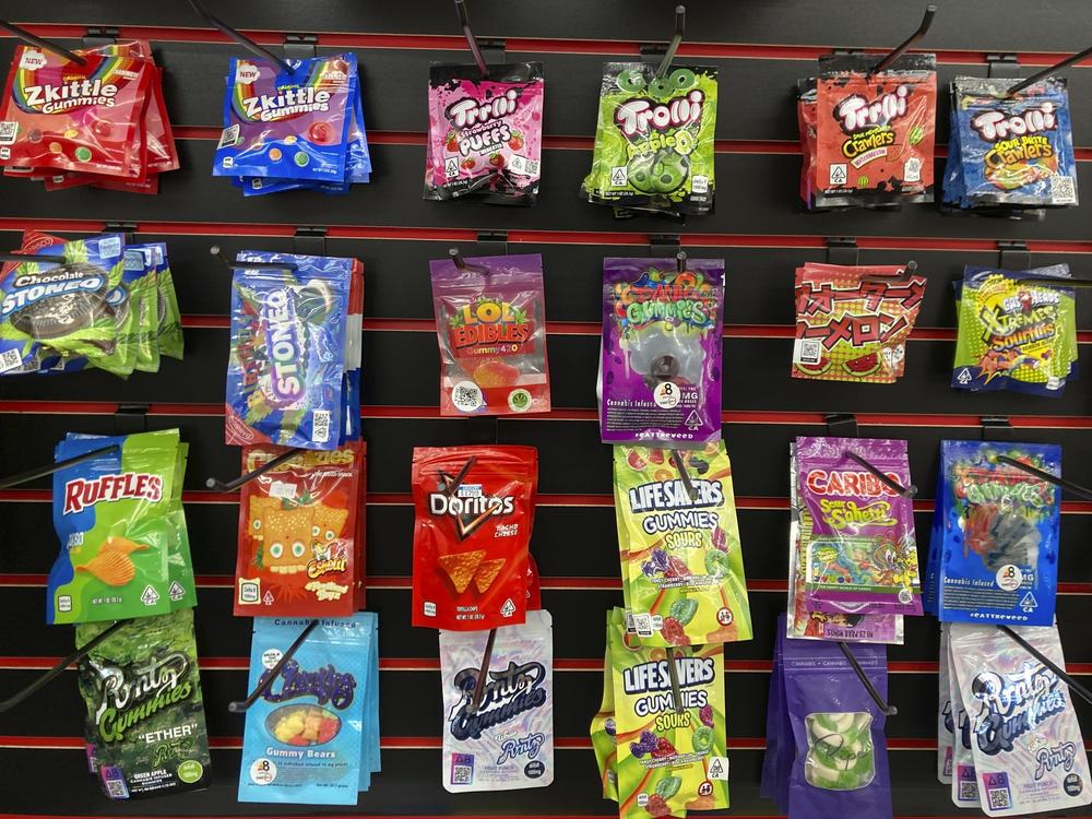 Edible products advertised as containing delta-8 THC offered for sale at a smoke shop in Seattle in 2022. Teens can overdo it with products like these, health officials warn.