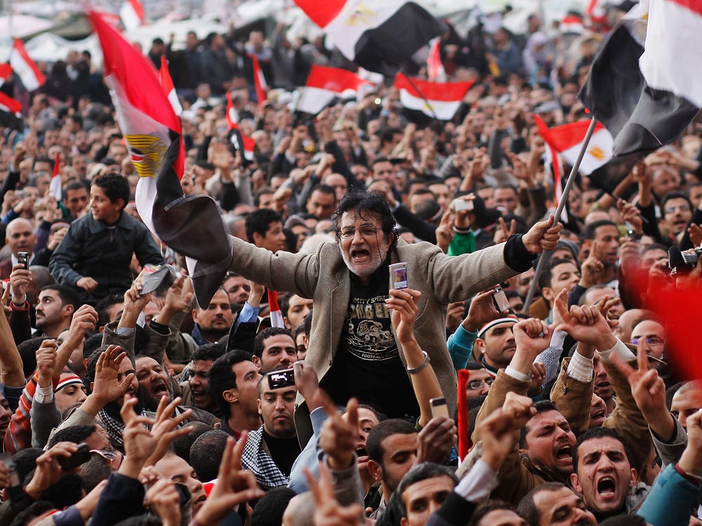 An anti-government protester is carried on shoulders in Tahrir Square in the afternoon before a speech by Egyptian President Hosni Mubarak in Tahrir Square February 10, 2011 in Cairo, Egypt.