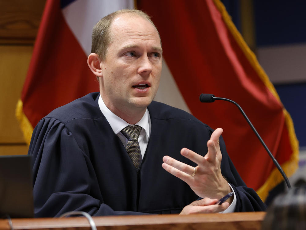 Fulton County Superior Judge Scott McAfee presides in court during a hearing in the Georgia election interference case.