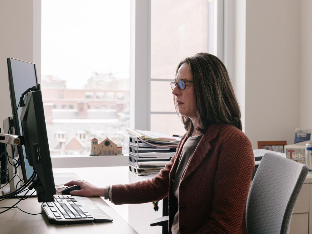 Sara Jaffee in her office at the University of Pennsylvania. She and UPenn colleague Vincent Reina will evaluate Philadelphia's pilot, including how renters with cash fare compared to those with vouchers.