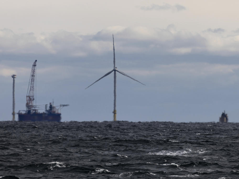 The first operating South Fork Wind farm turbine stands east of Montauk Point, N.Y., on Dec. 7, 2023. South Fork Wind, America's first commercial-scale offshore wind farm, is officially open.