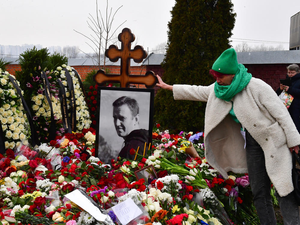 A mourner visits the grave of Russian opposition leader Alexei Navalny at the Borisovo cemetery in Moscow on March 2, the day after Navalny's funeral.