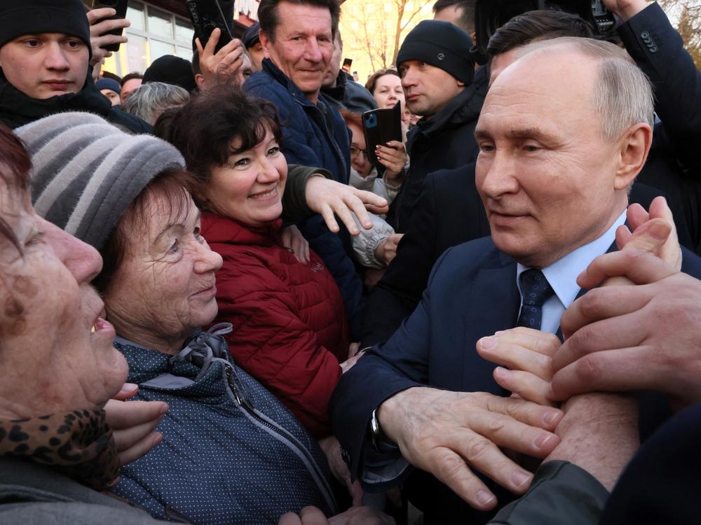 President Vladimir Putin meets with local residents in Stavropol on March 5, in this photograph distributed by a Russian state-owned agency.