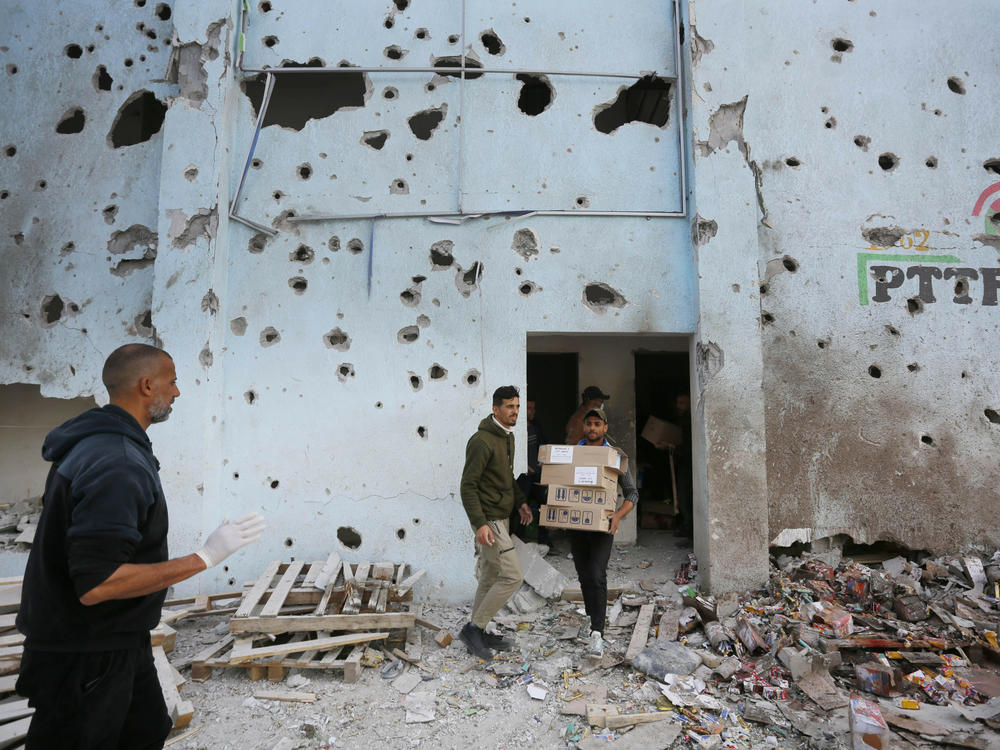 A view of destruction after an Israeli strike on a humanitarian aid distribution warehouse at Nuseirat refugee camp in Deir al-Balah, Gaza, on Thursday.