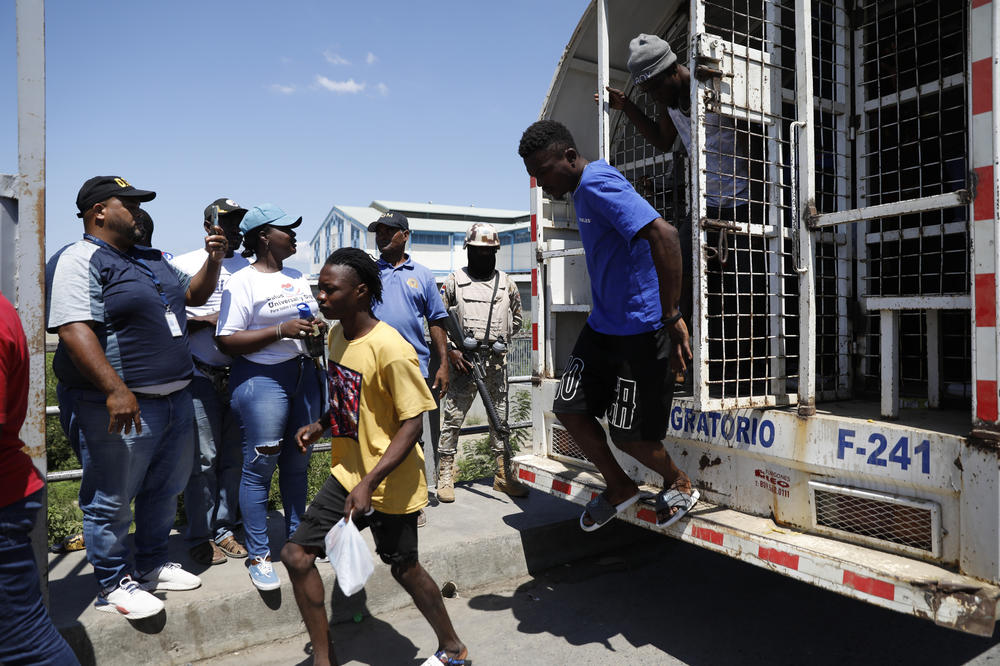 Haitian citizens who were detained by the Dominican Republic's authorities arrive at the Haitian border for deportation, on Wednesday.