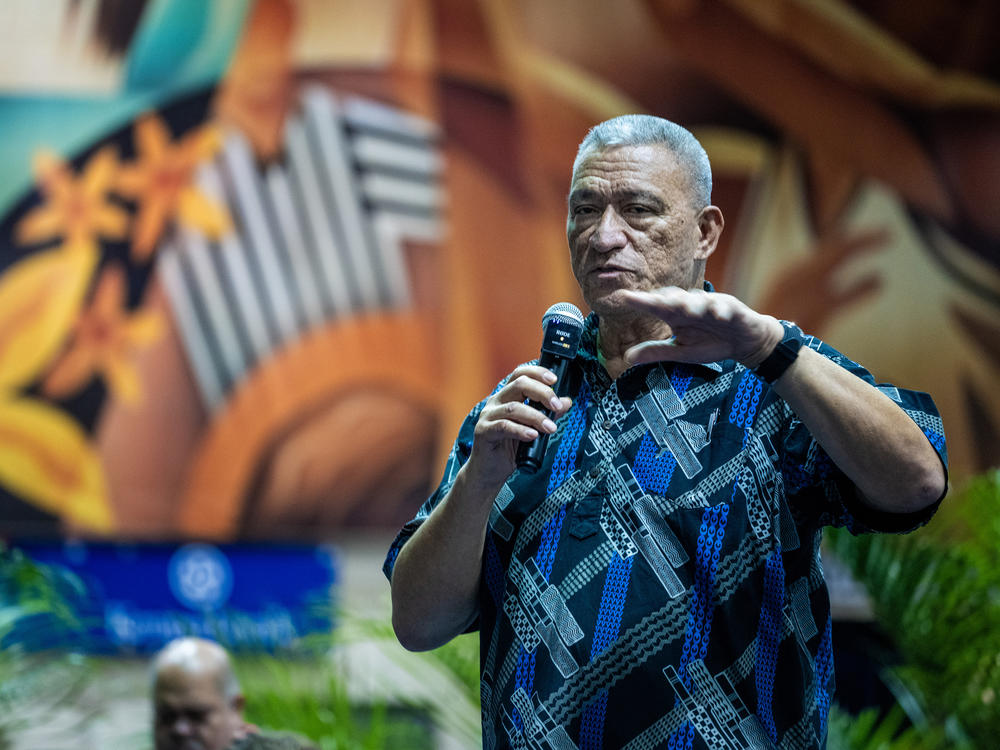 Maui Mayor Richard Bissen speaks at a community meeting at the Lahaina Civic Center. A complex cleanup is underway seven months after the wildfire, intended to protect historic buildings and artifacts.